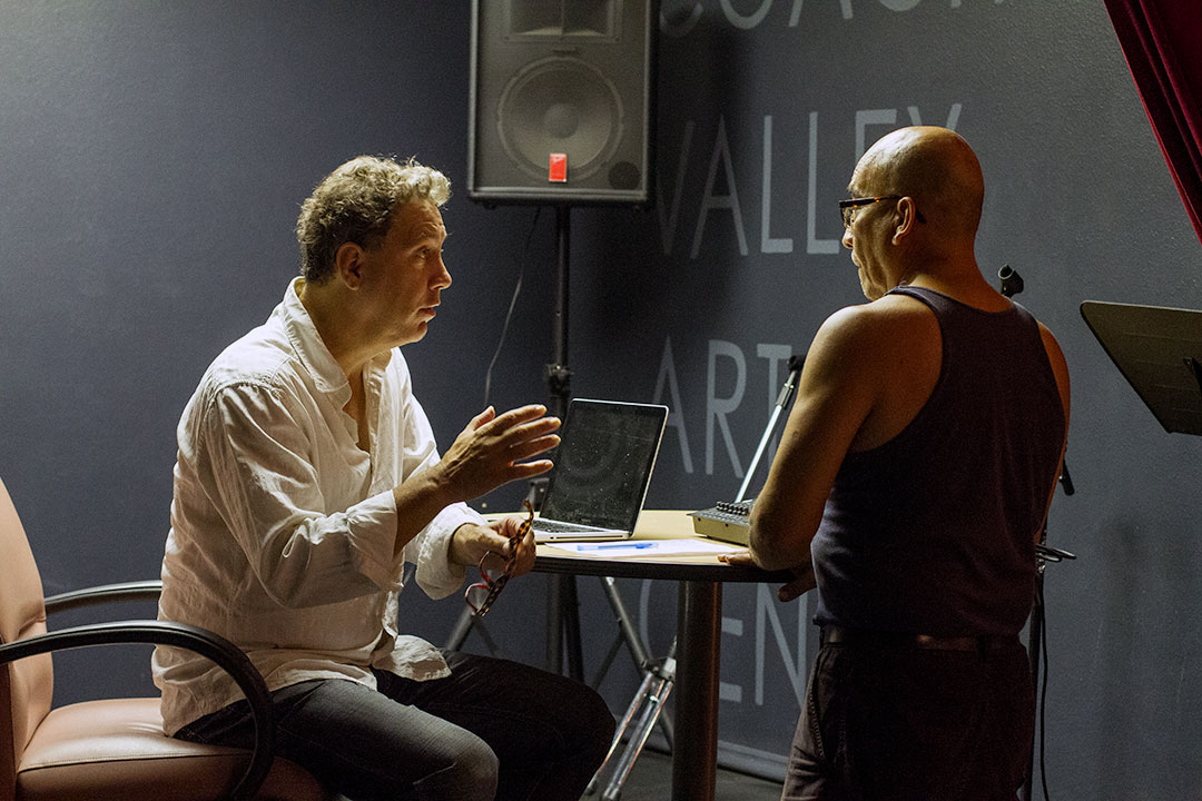 David Gonzalez coaching a participant in a creative workshop