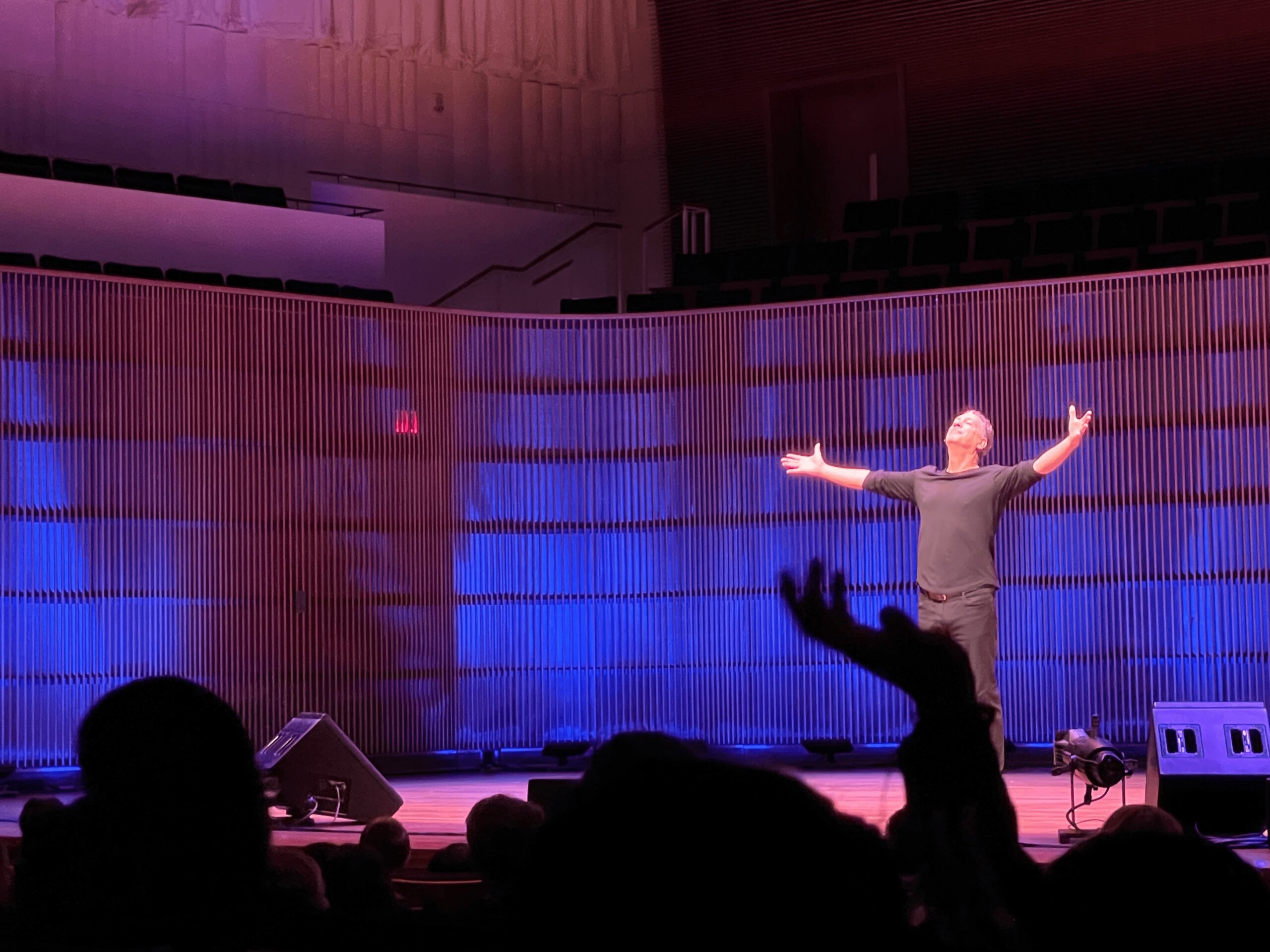 David Gonzalez performing a story on stage